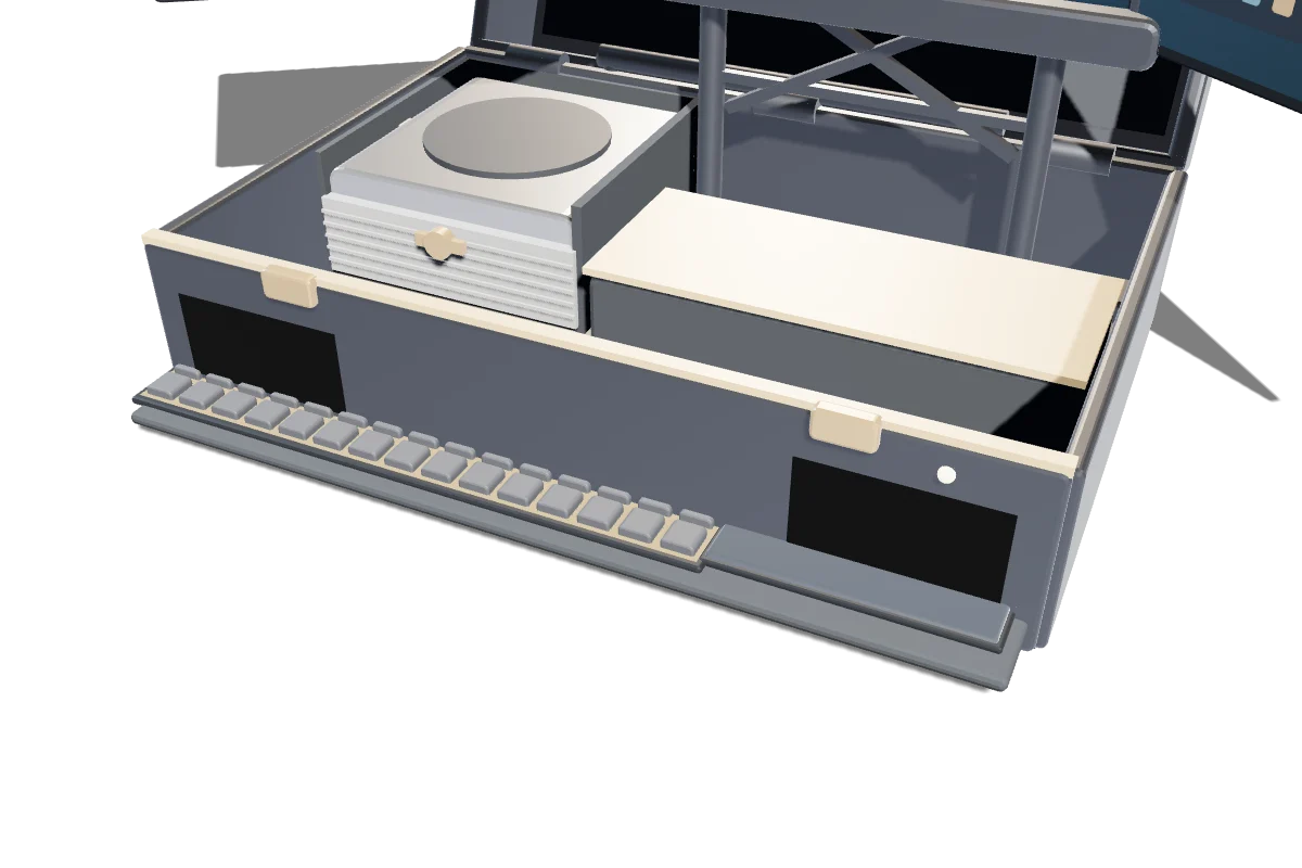 The base with the keyboard tray slid forward, the compute bay and battery behind it.